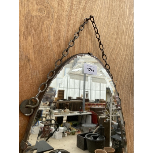 1247 - AN OVAL ART DECO BEVELED EDGE WALL MIRROR WITH HANGING CHAIN