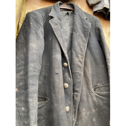 1252 - A RARE COLLECTION OF FRED DIBNAH MBE CLOTHING TO INCLUDE BIB AND BRACES, JACKETS AND FURTHER WORK CL... 