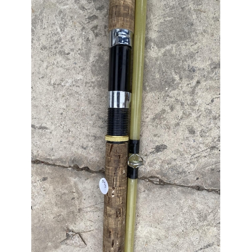 1369 - A TWO SECTION GLASS SEA FISHING ROD