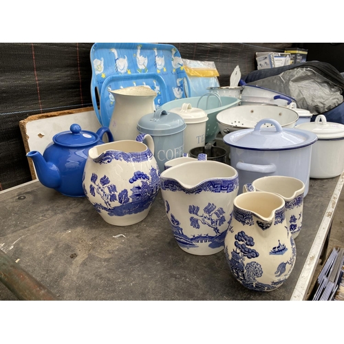 1383 - A LARGE ASSORTMENT OF RETRO KITCHEN ITEMS TO INCLUDE TRAYS, JUGS AND TEA CADDIES ETC