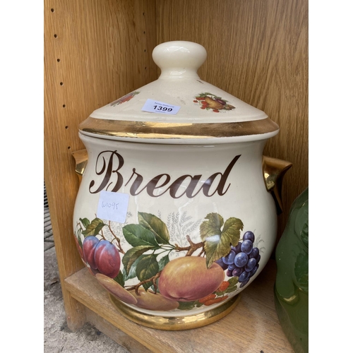 1399 - A LARGE DECORATIVE BREAD CROCK WITH FRUIT DESIGN AND A GREEN POTATO STORAGE POT