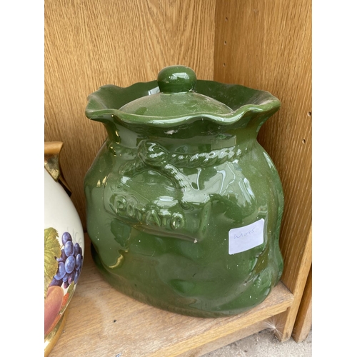 1399 - A LARGE DECORATIVE BREAD CROCK WITH FRUIT DESIGN AND A GREEN POTATO STORAGE POT