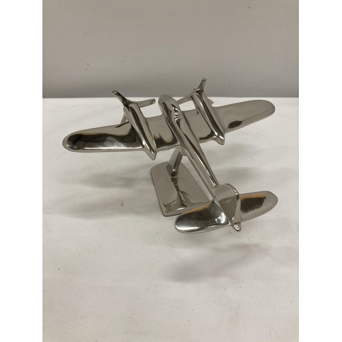 249 - A CHROME MODEL OF A WW11 BOMBER ON STAND HEIGHT 10 CM, LENGTH 17 CM