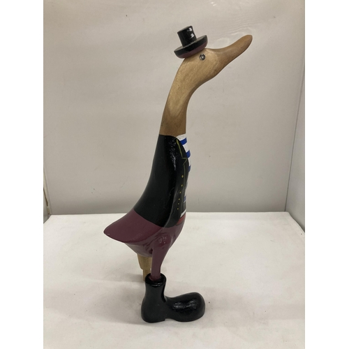 252 - A WOODEN 'PIRATE' DUCK WITH A PEG LEG HEIGHT 39.5CM