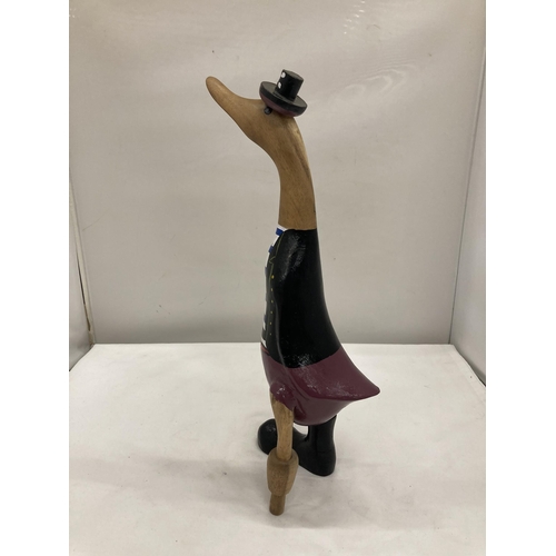 252 - A WOODEN 'PIRATE' DUCK WITH A PEG LEG HEIGHT 39.5CM