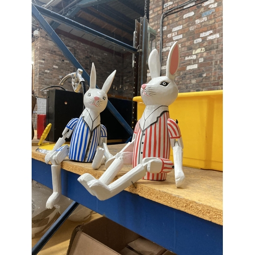 257 - A PAIR OF SHELF RABBITS WITH STRIPED JACKETS HEIGHT 46CM