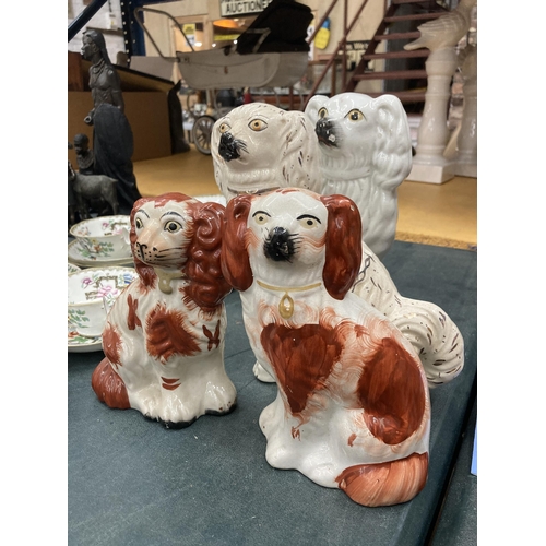 269 - A PAIR OF RED AND WHITE STAFFORDSHIRE MANTLE DOGS HEIGHT 18CM PLUS TWO WHITE ONES HEIGHT 24CM