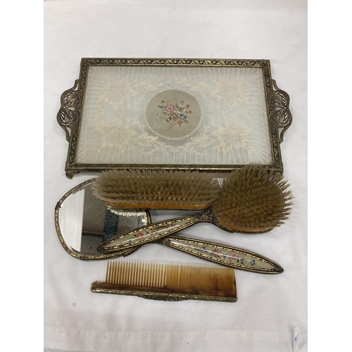 276 - A LACE EMBROIDERY DRESSING TABLE TRAY WITH BRUSHES, MIRROR AND COMB ALL WITH BACK EMBROIDERY