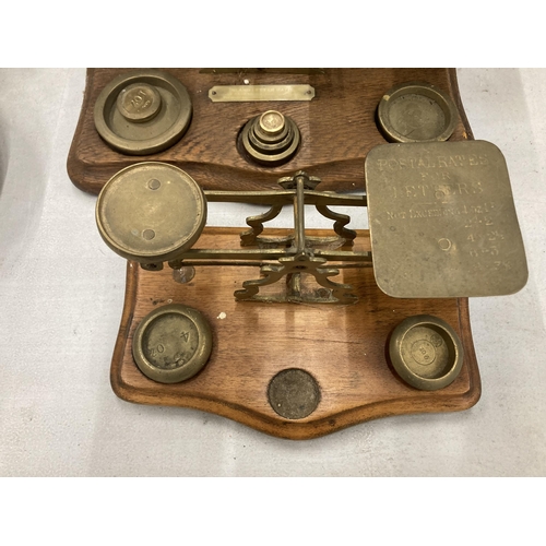 281 - TWO SETS OF WOOD AND BRASS POSTAL SCALES WITH WEIGHTS