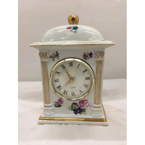 151 - A PAIR OF RENAISSANCE STYLE ORNATE TRINKET BOXES WITH CHERUBS PLUS A FLORAL CERAMIC MANTLE CLOCK