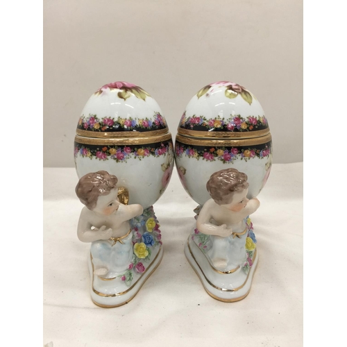 151 - A PAIR OF RENAISSANCE STYLE ORNATE TRINKET BOXES WITH CHERUBS PLUS A FLORAL CERAMIC MANTLE CLOCK