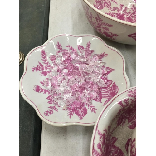 155 - A PINK AND WHITE FLORAL PATTERN BATHROOM SET TO INCLUDE JUG AND BOWL, CANDLESTICK, LARGE BOWL, LARGE... 