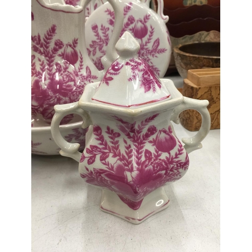 155 - A PINK AND WHITE FLORAL PATTERN BATHROOM SET TO INCLUDE JUG AND BOWL, CANDLESTICK, LARGE BOWL, LARGE... 