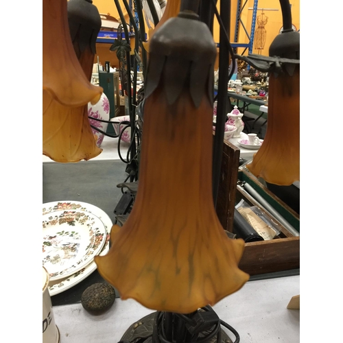 165 - AN ART NOUVEAU STYLE TABLE LAMP WITH SIX BRANCHES AND AMBER GLASS SHADES - WORKING AT TIME OF CATALO... 