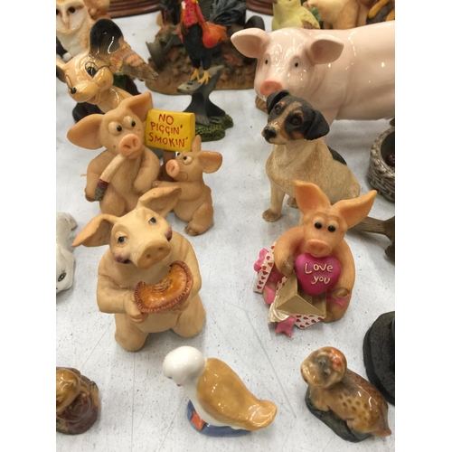 174 - A LARGE QUANTITY OF CERAMIC AND RESIN ANIMAL FIGURES TO INCLUDE PIGGIN', LEONARDO MODELS OF COWS AND... 