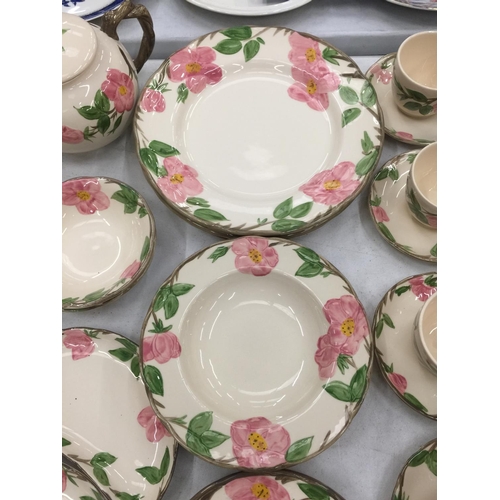 183 - A QUANTITY OF JOHNSONS BROS DESERT ROSE CERAMIC DINNERWARE TO INCLUDE PLATES, CUPS, SAUCERS, TEAPOT,... 