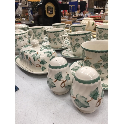 185 - A QUANTITY OF CERAMIC TEAWARE TO INCLUDE CUPS, SAUCERS, PLATES, BOWLS, SUGAR BOWL, CREAM JUG, BUTTER... 