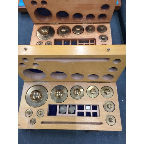 206 - A SET OF BRASS TRAVELLING SCALES AND TWO SETS OF BRASS WEIGHTS ALL IN WOODEN BOXES