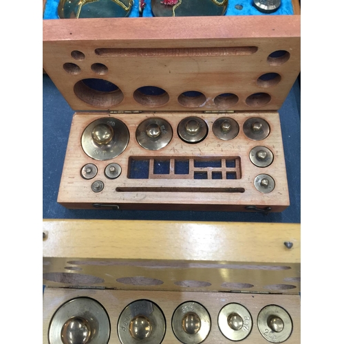 206 - A SET OF BRASS TRAVELLING SCALES AND TWO SETS OF BRASS WEIGHTS ALL IN WOODEN BOXES