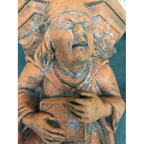 240 - A TERRACOTTA WALL HANGING MINSTREL HEIGHT 56CM