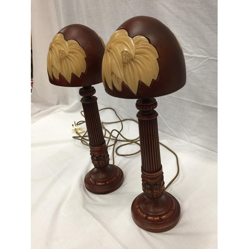 44 - A PAIR OF UNUSUAL LAMPS WITH WOODEN COLUMN STYLE BASES AND MUSHROOM STYLE SHADES H: 48CM