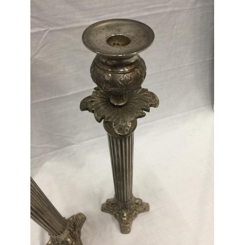 48 - A PAIR OF SILVER PLATED CANDLESTICKS WITH COLUMN DECORATION HEIGHT 45.5CM