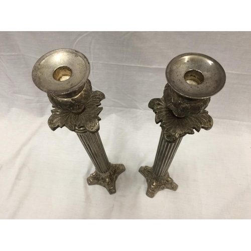 48 - A PAIR OF SILVER PLATED CANDLESTICKS WITH COLUMN DECORATION HEIGHT 45.5CM