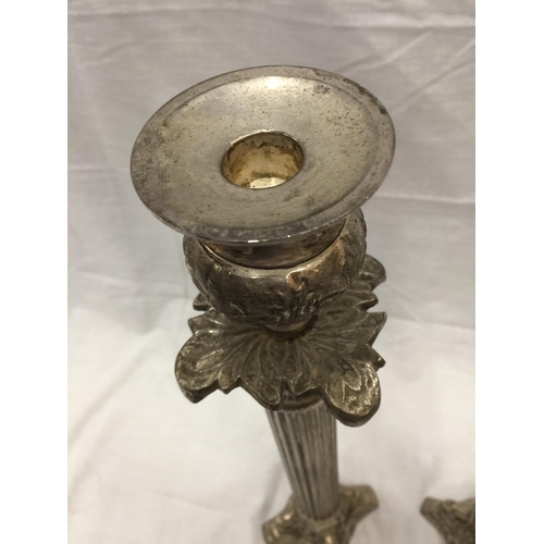 48 - A PAIR OF SILVER PLATED CANDLESTICKS WITH COLUMN DECORATION HEIGHT 45.5CM