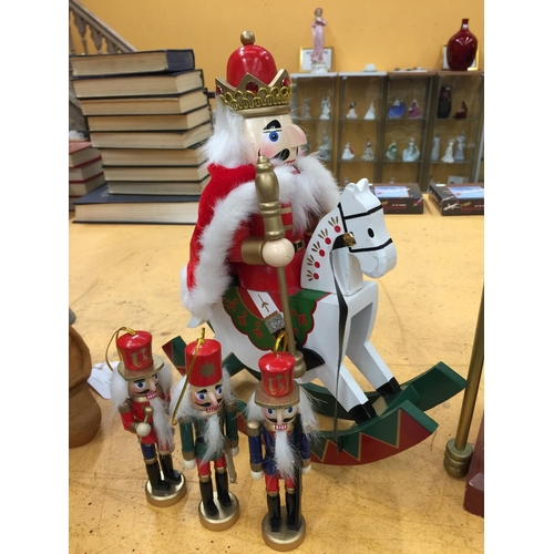 53 - A COLLECTION OF NUTCRACKER FIGURES TO INCLUDE A VERY LARGE GUARD (61CM), A KING RIDING A ROCKING HOR... 