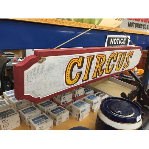 56 - A PAINTED WOODEN CIRCUS HANGING SIGN W: 100CM