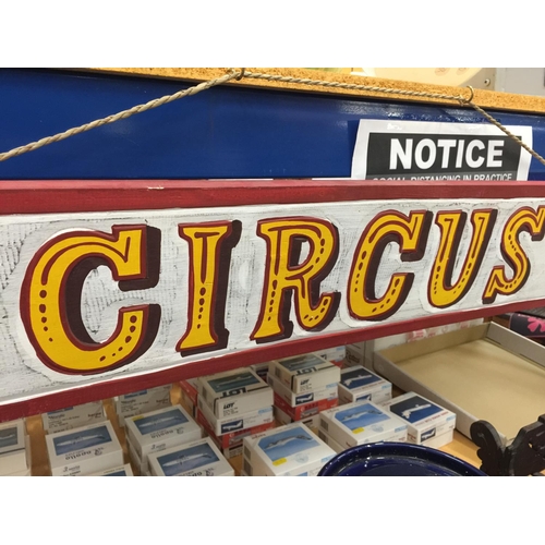 56 - A PAINTED WOODEN CIRCUS HANGING SIGN W: 100CM