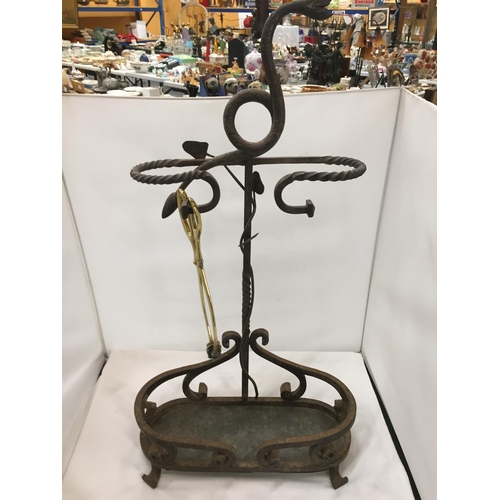 476 - A VICTORIAN WROUGHT IRON UMBRELLA STAND WITH SERPENTINE TOP AND BARLEY TWIST ARMS HEIGHT 73CM