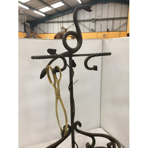 476 - A VICTORIAN WROUGHT IRON UMBRELLA STAND WITH SERPENTINE TOP AND BARLEY TWIST ARMS HEIGHT 73CM