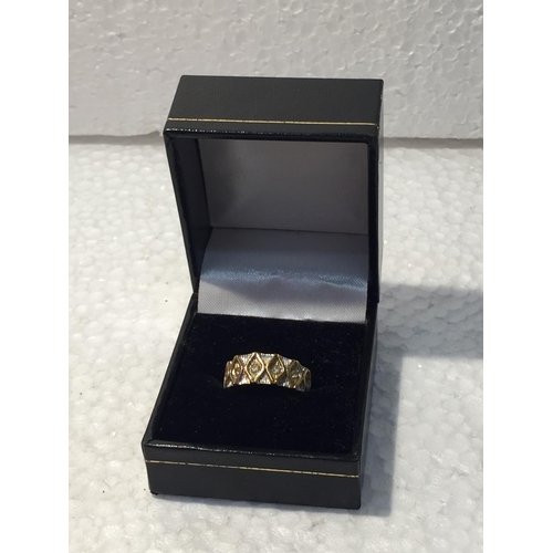 648 - A YELLOW METAL RING MARKED 18KT SIZE L IN A PRESENTATION BOX