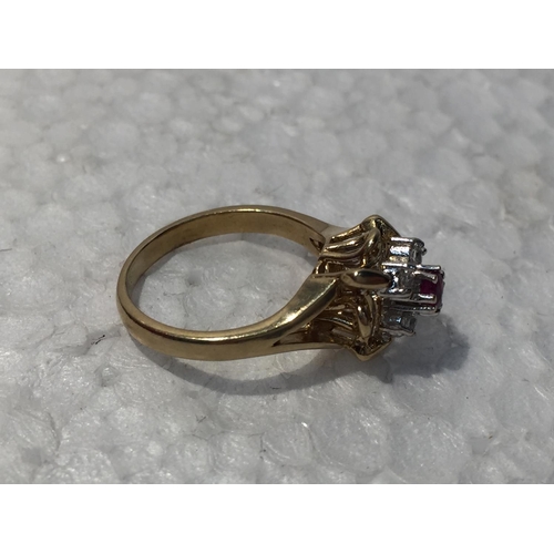 653 - A 9CT GOLD RING WITH RUBY AND CUBIC ZIRCONIA STONES