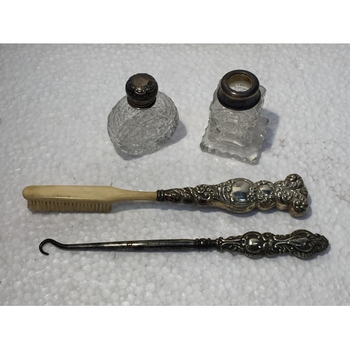 667 - A VINTAGE HALLMARKED BIRMINGHAM AND STERLING SILVER BUTTON HOOK, BRUSH, PERFUME TOP AND CONDIMENT RI... 