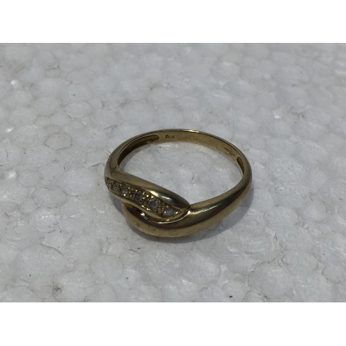 668 - A 9CT GOLD RING WITH SIX DIAMONDS