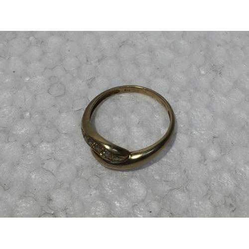 668 - A 9CT GOLD RING WITH SIX DIAMONDS