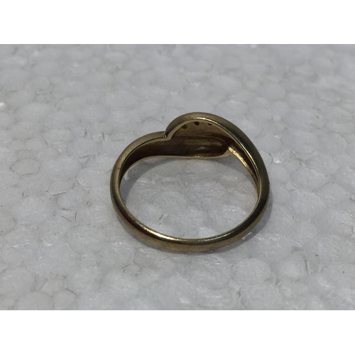 668 - A 9CT GOLD RING WITH SIX DIAMONDS