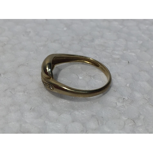 668 - A 9CT GOLD RING WITH SIX DIAMONDS