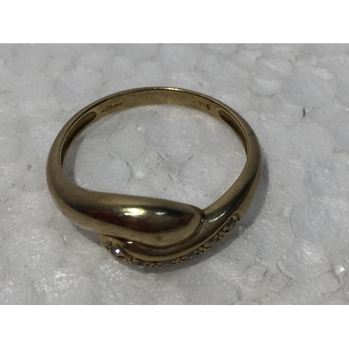 668 - A 9CT GOLD RING WITH SIX DIAMONDS