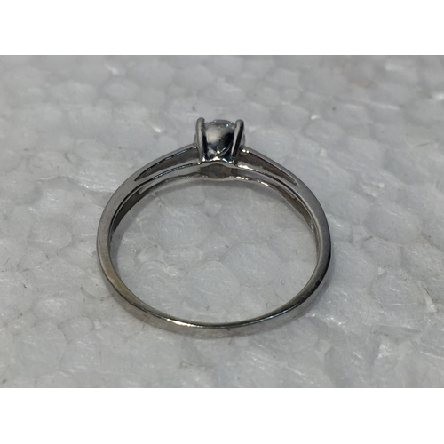 680 - A 9CT WHITE GOLD RING WITH CUBIC ZIRCONIA STONES