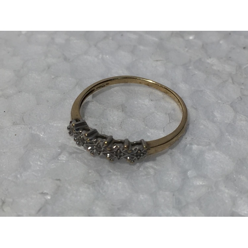 683 - A 9CT GOLD RING WITH DIAMONDS