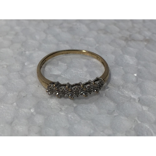 683 - A 9CT GOLD RING WITH DIAMONDS