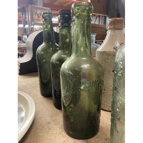 382 - A COLLECTION OF VINTAGE BOTTLES TO INCLUDE GREEN AND CLEAR MOST WITH MANUFACTURERS NAMES