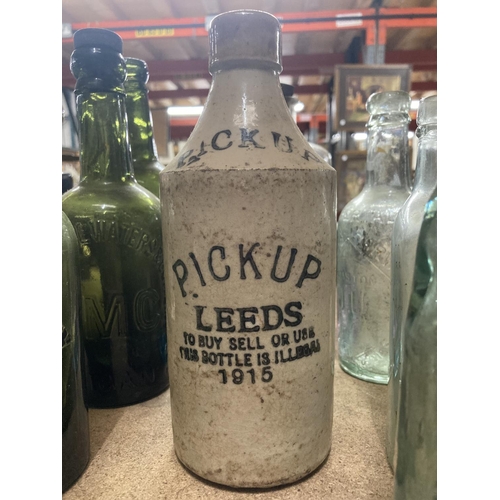 382 - A COLLECTION OF VINTAGE BOTTLES TO INCLUDE GREEN AND CLEAR MOST WITH MANUFACTURERS NAMES