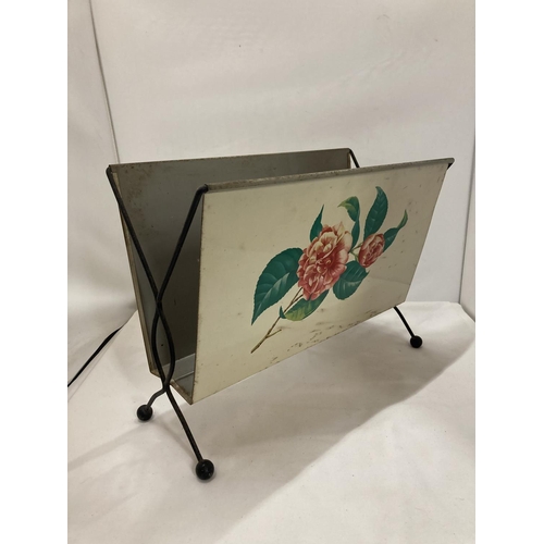 410 - A VINTAGE CREAM MAGAZINE RACK WITH ROSE DECORATION