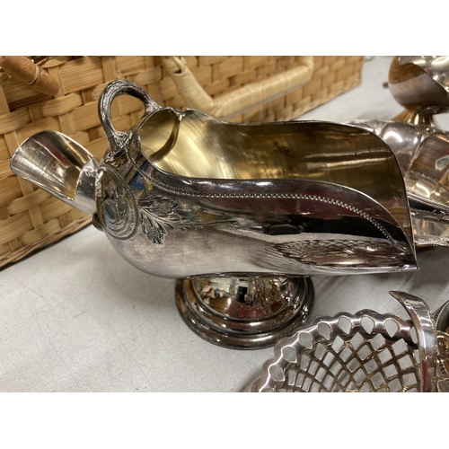 419 - A QUANTITY OF SILVER PLATED ITEMS TO INCLUDE A CRUET SET, TOAST RACK, CANDLESTICK, PIERCED WORK BASK... 