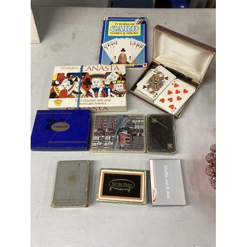 425 - A QUANTITY OF PACKS OF VINTAGE PLAYING CARDS PLUS A CARD GAMES AND TRICKS BOOK