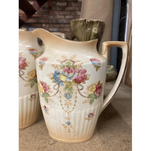 428 - THREE BLUSH IVORY JUGS BY CROWN DEVON IN GRADUATING SIZES